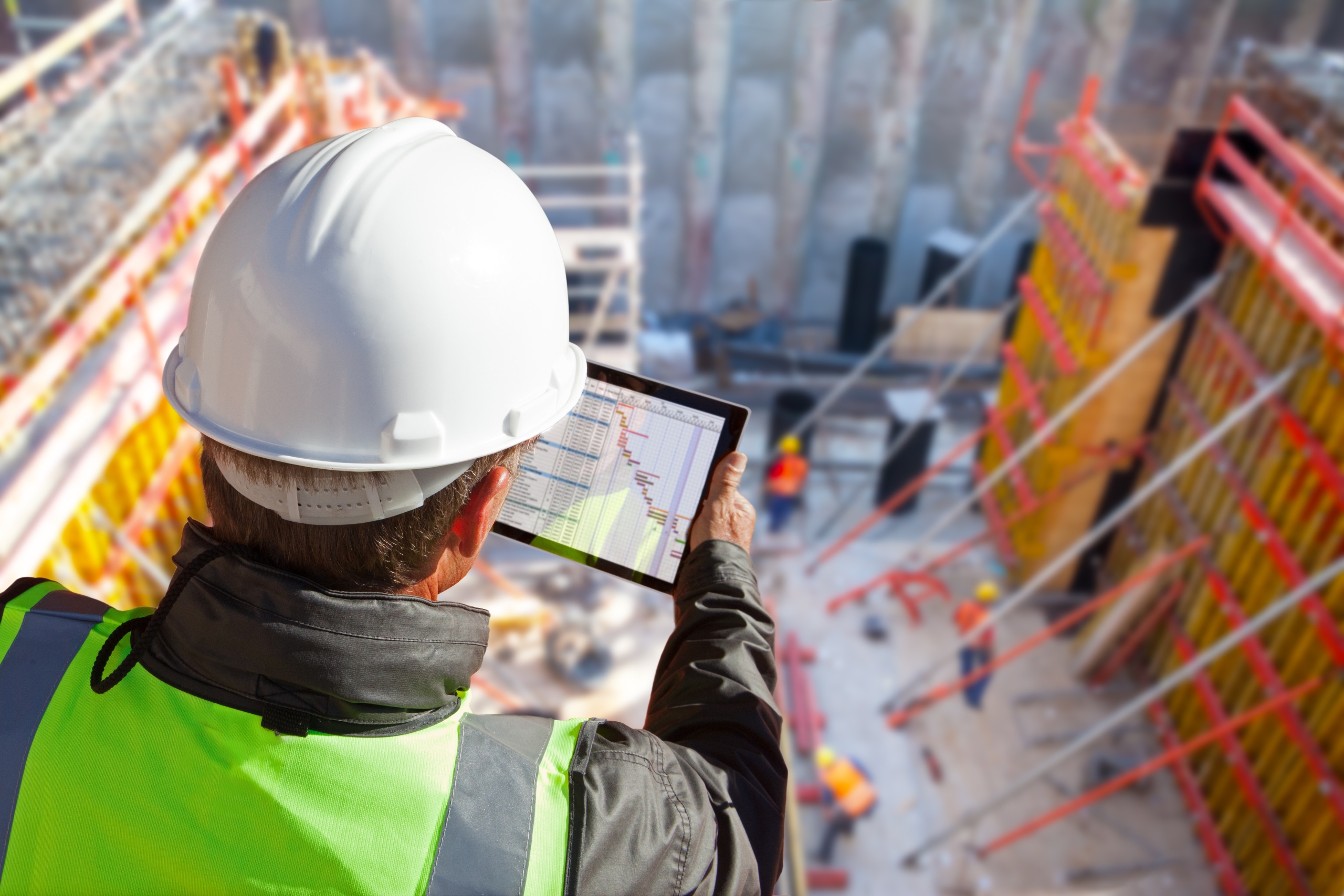 Civil,Engineer,Or,Architect,With,Hardhat,On,Construction,Site,Checking